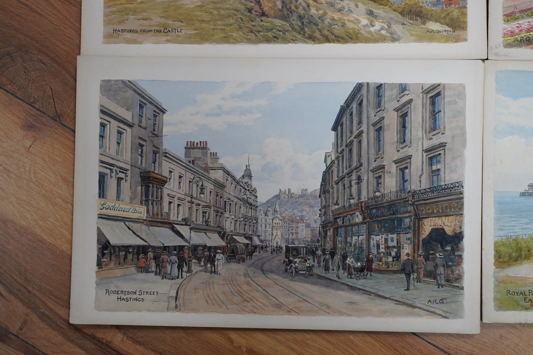 Alfred Robert Quinton (1853-1934), set of four original watercolours for postcard designs, Sussex coastal views comprising: Royal Parade bandstand, Eastbourne, Grand Parade, Eastbourne, Hastings from the castle and Rober